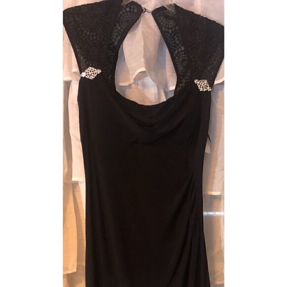 Turn heads with this R & M Richards black cap sleeve beaded gown.Retail $149.00 - Picture 11 of 16